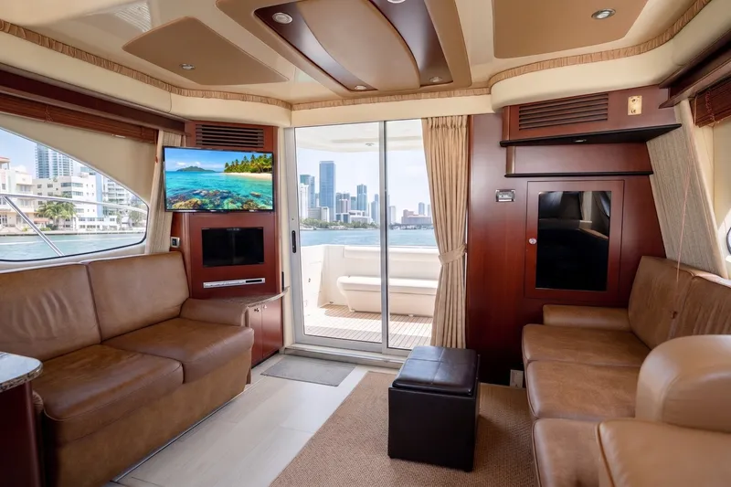 Slide: The Image of Luxurious interior of 2006 Sea Ray 44 Sedan Bridge yacht with city skyline view. - 24