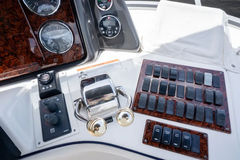 Slide: The Image of Control panel of a 2006 Sea Ray 44 Sedan Bridge yacht with gauges and switches. - 21