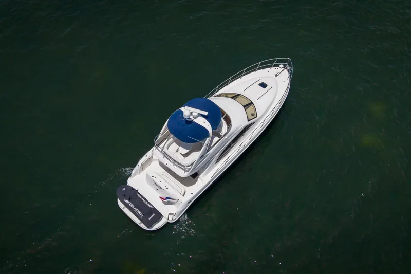 Slide: The Image of Aerial view of 2006 Sea Ray 44 Sedan Bridge yacht cruising on open water. - 7