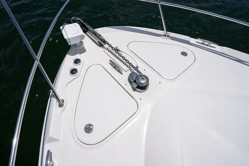 Slide: The Image of Bow of 2006 Sea Ray 44 Sedan Bridge with anchor chain and railing. - 14