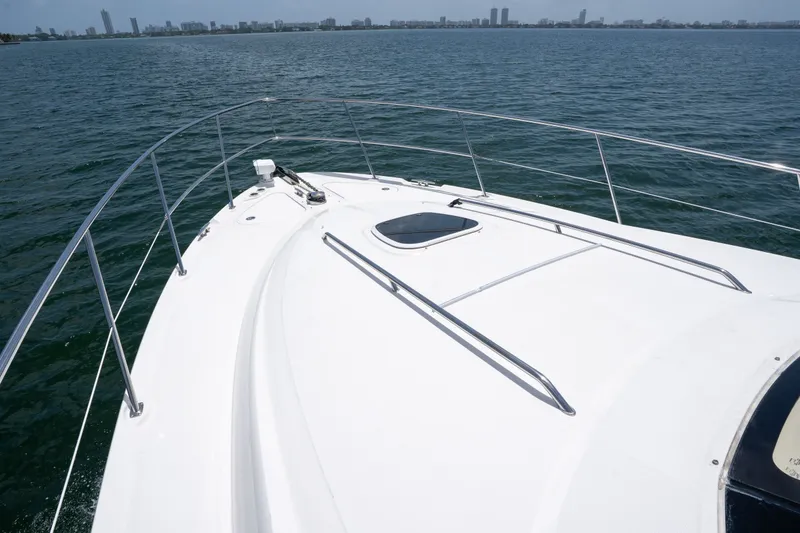 Slide: The Image of Bow view of 2006 Sea Ray 44 Sedan Bridge yacht on open water. - 13
