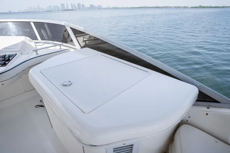 Slide: The Image of 2006 Sea Ray 44 Sedan Bridge yacht deck with ocean view and city skyline. - 22