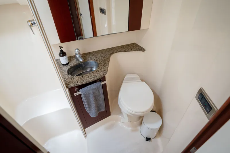 Slide: The Image of Luxurious bathroom in 2006 Sea Ray 44 Sedan Bridge yacht with granite countertop. - 36