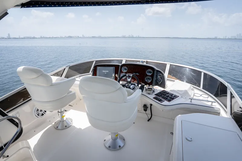 Slide: The Image of Luxurious helm of 2006 Sea Ray 44 Sedan Bridge yacht with panoramic ocean view. - 17
