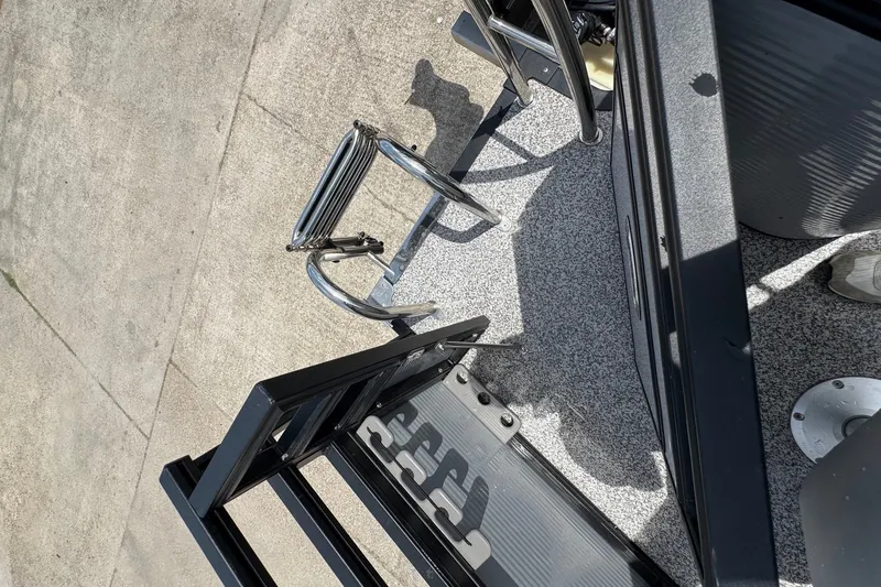 Slide: The Image of 2023 Angler Qwest 8522 All Sport Gen II Triple Tube boat ladder and deck detail. - 22