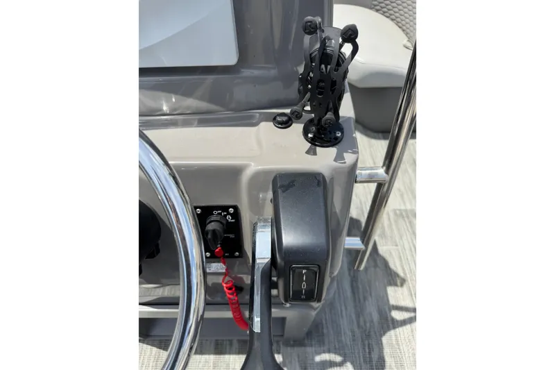 Slide: The Image of 2023 Angler Qwest 8522 All Sport Gen II boat dashboard with steering wheel and controls. - 14