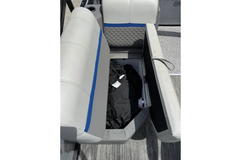 Slide: The Image of 2023 Angler Qwest 8522 All Sport Gen II boat seat storage compartment open. - 17