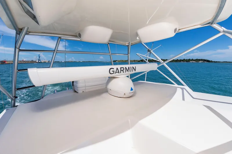 Slide: The Image of The image shows the deck of a 2004 Albemarle 410 Express Fisherman with a Garmin radar. - 29