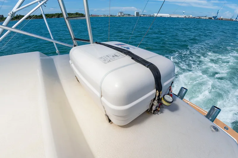 Slide: The Image of A life raft is secured on the deck of a 2004 Albemarle 410 Express Fisherman. - 31