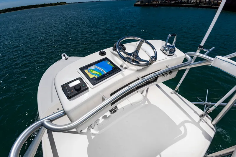 Slide: The Image of The image shows the helm of a 2004 Albemarle 410 Express Fisherman with a modern navigation system. - 25