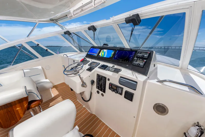 Slide: The Image of The 2004 Albemarle 410 Express Fisherman cockpit features modern navigation equipment and comfortable seating. - 22
