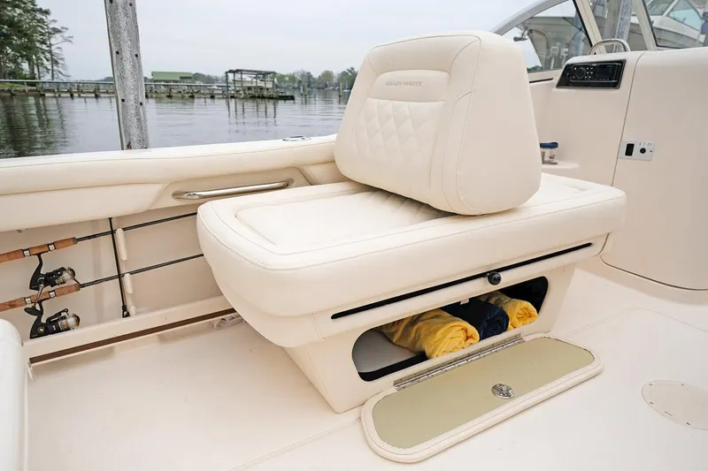 Slide: The Image of Manufacturer Provided Image: 2022 Grady-White Freedom 215 boat interior with storage compartment and fishing rod holders. - 25