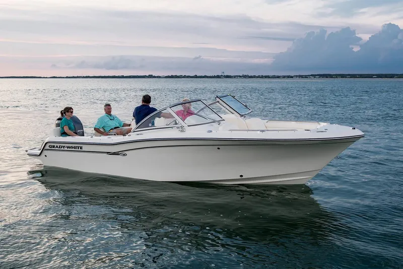 Slide: The Image of Manufacturer Provided Image: 2022 Grady-White Freedom 215 boat cruising on calm waters at sunset. - 16