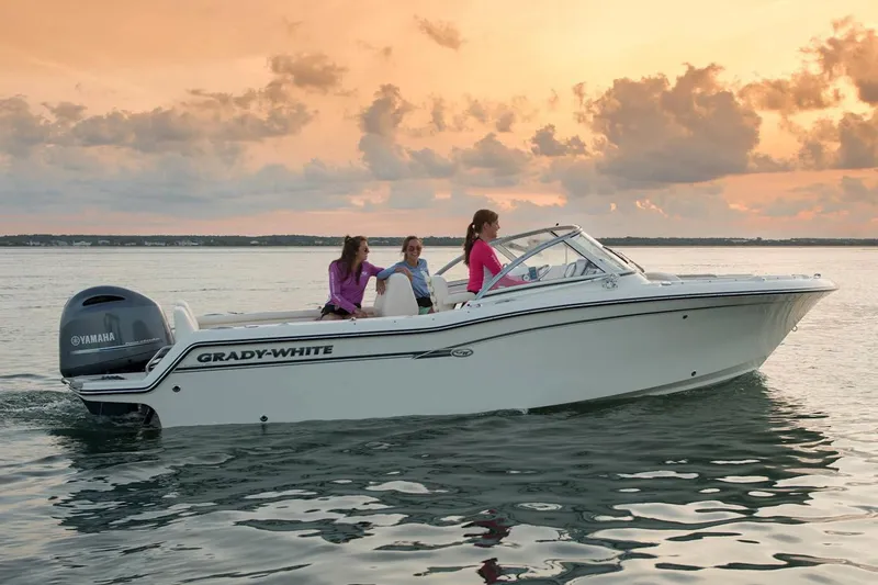 Slide: The Image of Manufacturer Provided Image: 2022 Grady-White Freedom 215 boat cruising at sunset with passengers. - 15