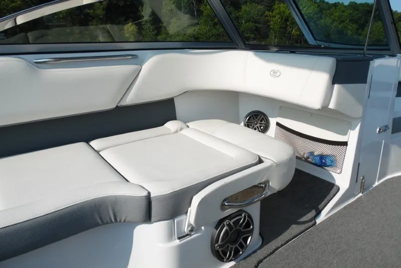 Slide: The Image of Interior of a 2020 Cobalt 220S boat with white seating and speaker system. - 21