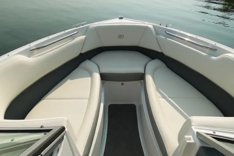 Slide: The Image of Interior view of a 2020 Cobalt 220S boat with white seating and sleek design. - 22