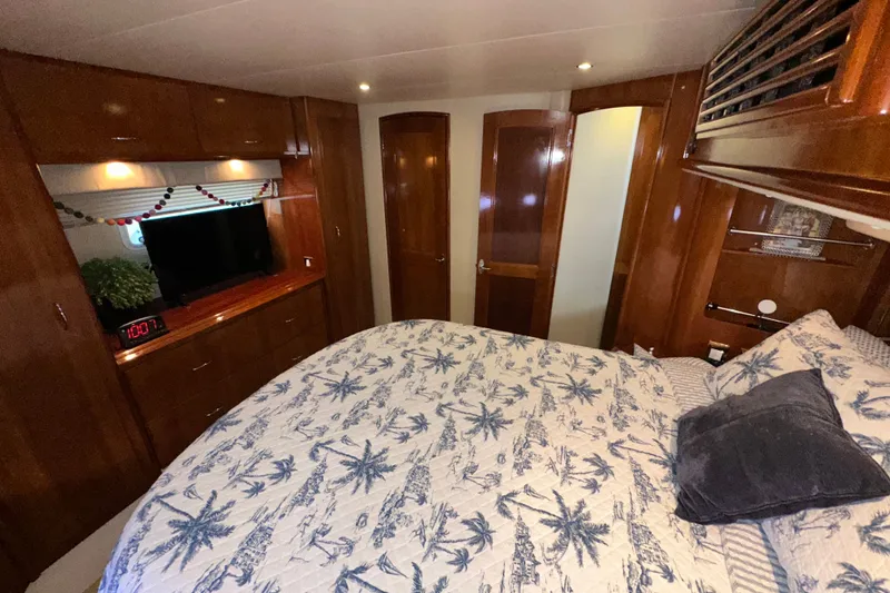 Slide: The Image of Luxurious bedroom interior of 2003 Carver 466 Motor Yacht with elegant wood finish. - 45