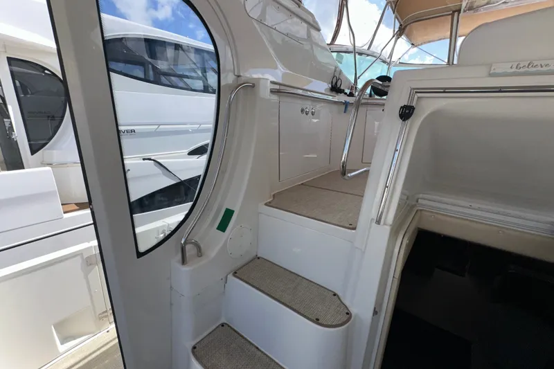 Slide: The Image of Interior view of a 2003 Carver 466 Motor Yacht, showcasing stairs and cabin entrance. - 72