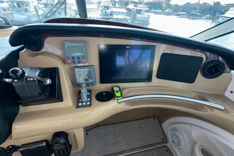 Slide: The Image of Helm of 2003 Carver 466 Motor Yacht with navigation controls and display screens. - 63