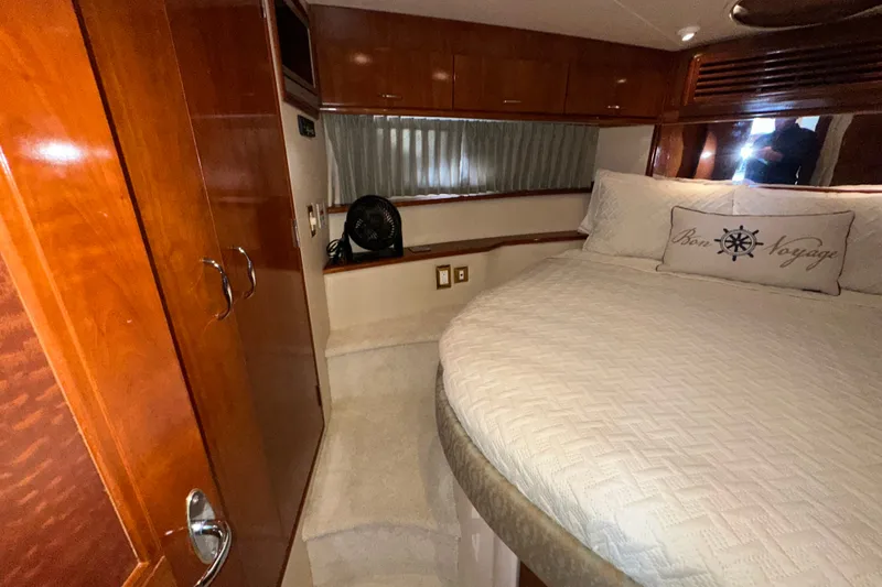 Slide: The Image of Luxurious bedroom interior of 2003 Carver 466 Motor Yacht with elegant wood finishes. - 13