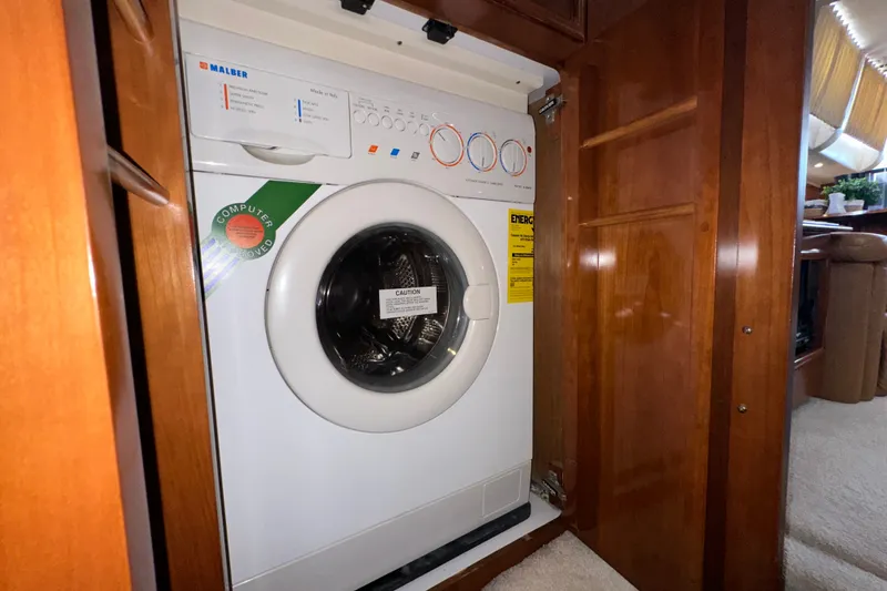 Slide: The Image of Built-in washing machine inside 2003 Carver 466 Motor Yacht, wooden cabinetry. - 41
