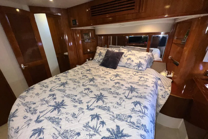 Slide: The Image of Luxurious bedroom interior of 2003 Carver 466 Motor Yacht with elegant wood finish. - 44