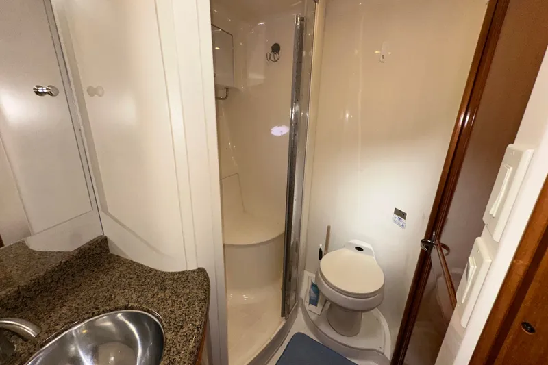 Slide: The Image of Bathroom interior of 2003 Carver 466 Motor Yacht with shower and toilet. - 18