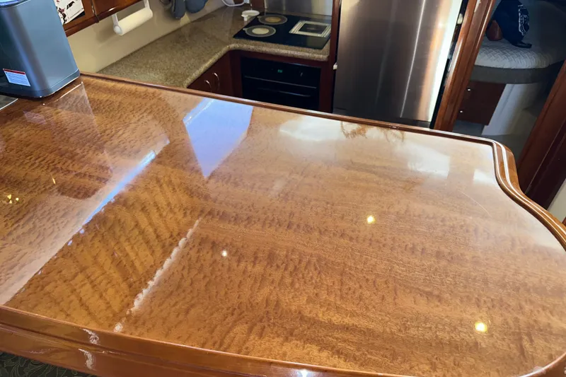 Slide: The Image of Luxurious interior of 2003 Carver 466 Motor Yacht with polished wood finish. - 28