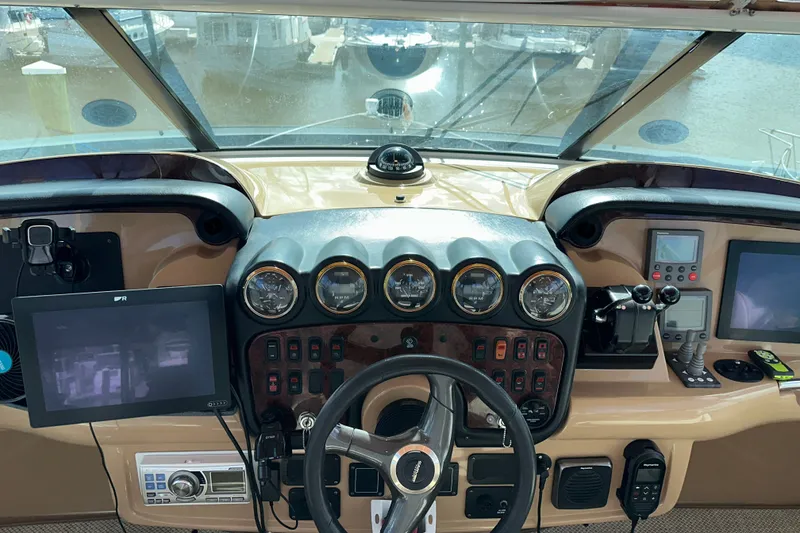 Slide: The Image of Helm of 2003 Carver 466 Motor Yacht with navigation instruments and controls. - 56