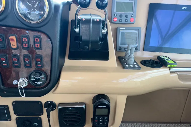 Slide: The Image of Control panel of a 2003 Carver 466 Motor Yacht with navigation instruments. - 59
