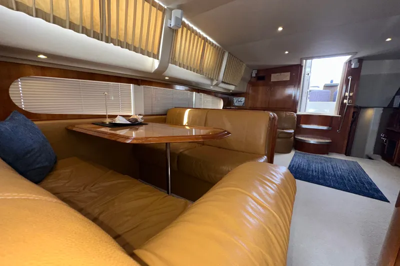 Slide: The Image of Luxurious interior of 2003 Carver 466 Motor Yacht with plush seating and elegant wood finishes. - 30