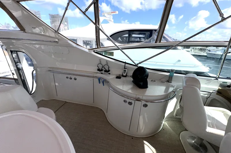 Slide: The Image of Interior view of 2003 Carver 466 Motor Yacht with seating and control area. - 52