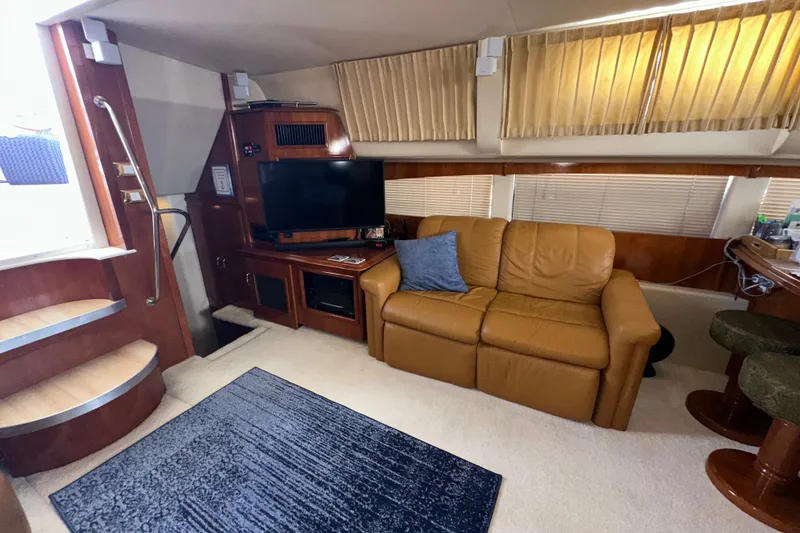 Slide: The Image of Interior of 2003 Carver 466 Motor Yacht with leather sofa and TV. - 33