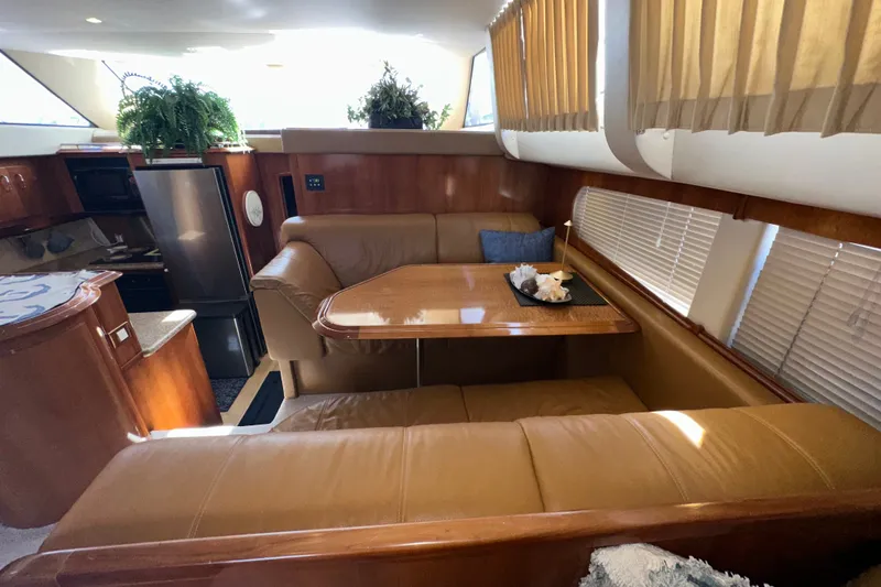 Slide: The Image of Luxurious interior of 2003 Carver 466 Motor Yacht with dining area and modern amenities. - 31