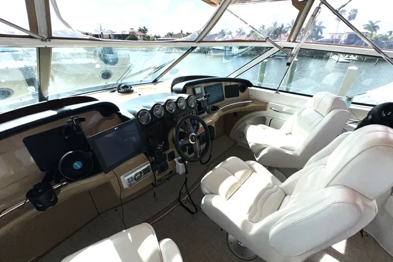 Slide: The Image of Interior helm of 2003 Carver 466 Motor Yacht with luxurious seating and navigation controls. - 66
