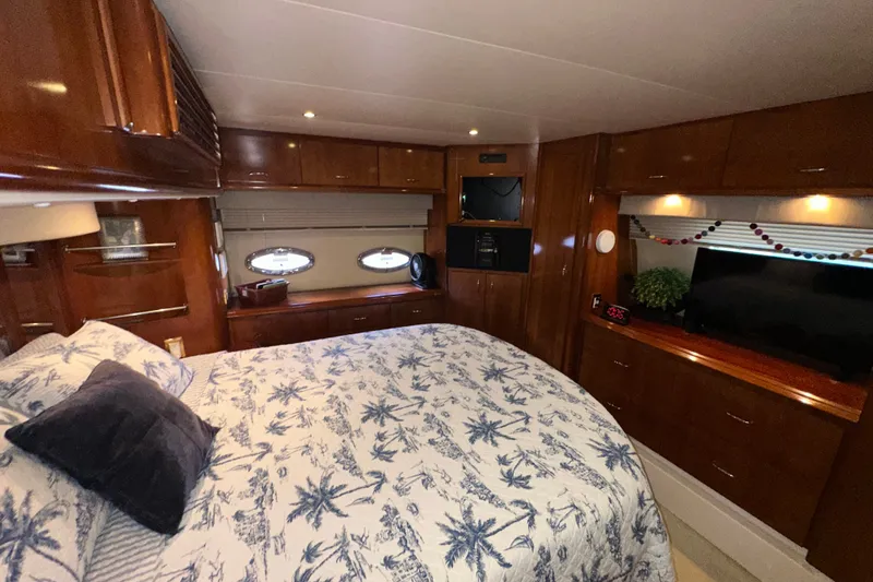 Slide: The Image of Luxurious bedroom interior of 2003 Carver 466 Motor Yacht with elegant wood finishes. - 42
