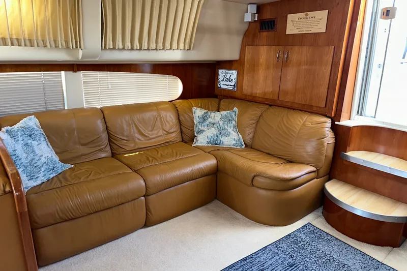 Slide: The Image of Luxurious interior of 2003 Carver 466 Motor Yacht with leather seating and decorative pillows. - 36