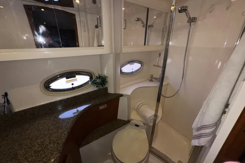 Slide: The Image of Luxurious bathroom in 2003 Carver 466 Motor Yacht with granite countertop and shower. - 48