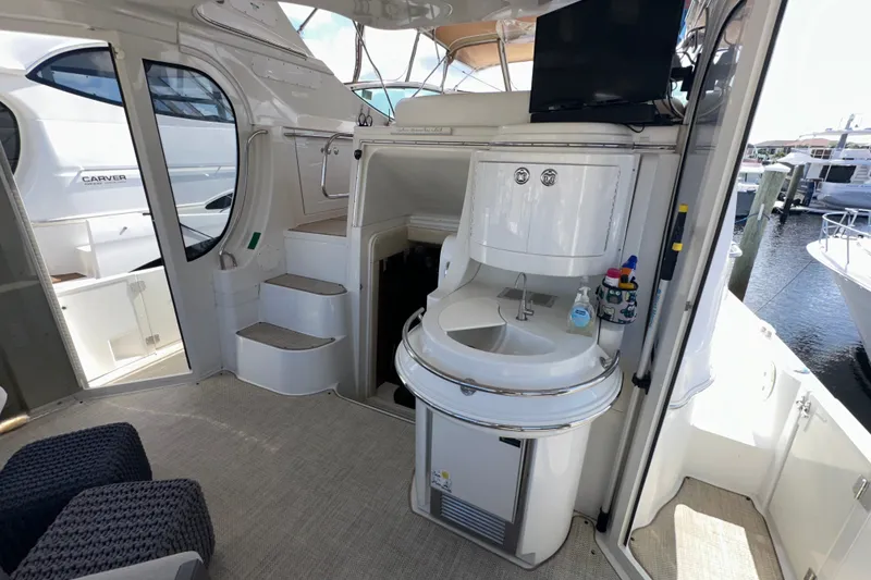 Slide: The Image of Interior of 2003 Carver 466 Motor Yacht with sink and seating area. - 69