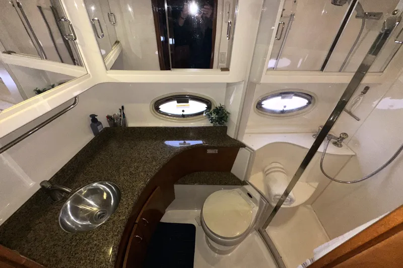 Slide: The Image of Luxurious bathroom in 2003 Carver 466 Motor Yacht with granite countertop and shower. - 49