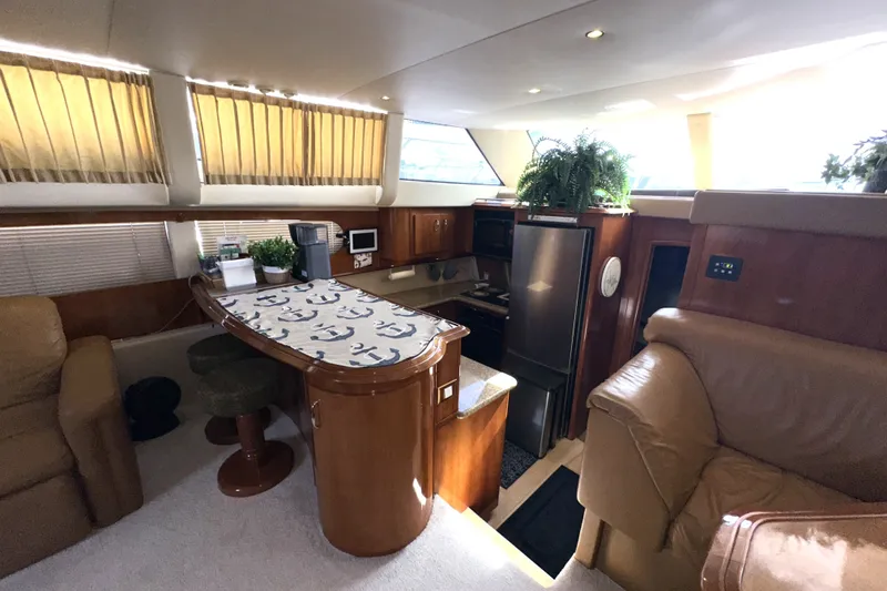 Slide: The Image of Luxurious interior of 2003 Carver 466 Motor Yacht with elegant furnishings and modern kitchen. - 32