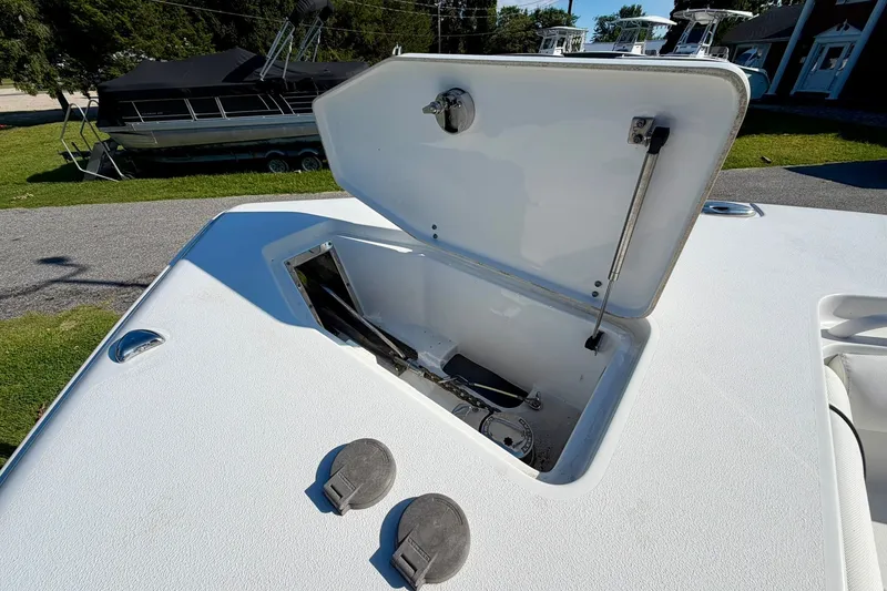 Slide: The Image of Open storage compartment on 2017 Sea Hunt Gamefish 30CB boat deck. - 16