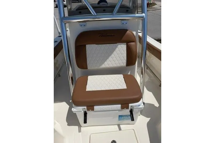 Slide: The Image of 2025 Pioneer 220 Bay Sport boat seat with brown and white cushioned design. - 17