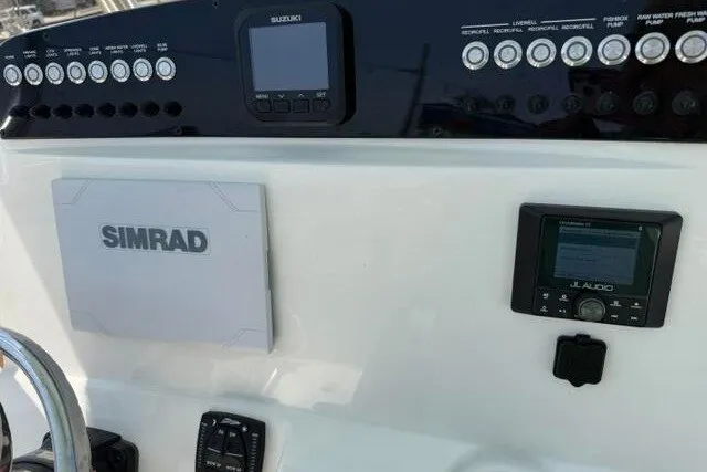 Slide: The Image of Dashboard of 2025 Pioneer 220 Bay Sport boat with Simrad and JL Audio systems. - 37