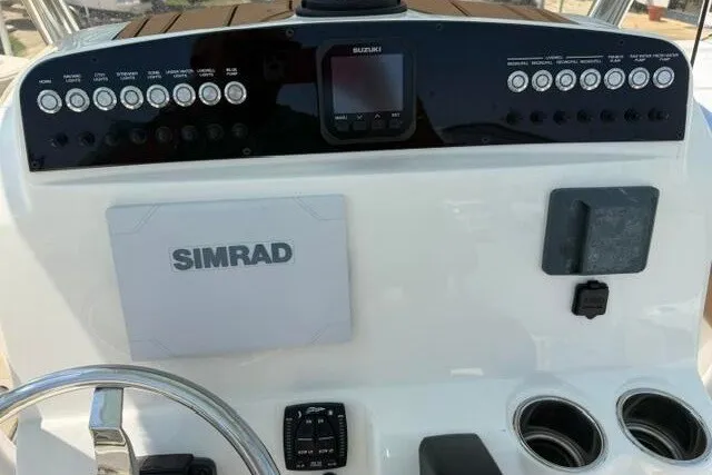Slide: The Image of Control panel of 2025 Pioneer 220 Bay Sport boat with Simrad navigation system. - 35