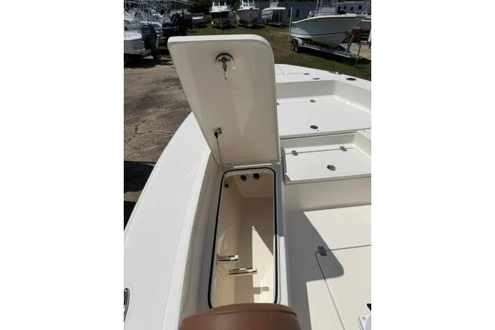 Slide: The Image of Open storage compartment on 2025 Pioneer 220 Bay Sport boat deck. - 16
