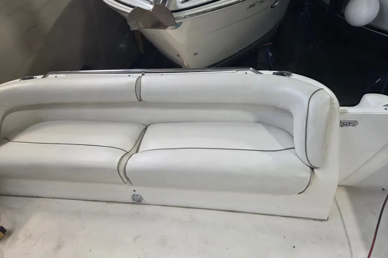 Slide: The Image of White leather seating on a 1997 Sea Ray 440 Express Bridge yacht. - 15