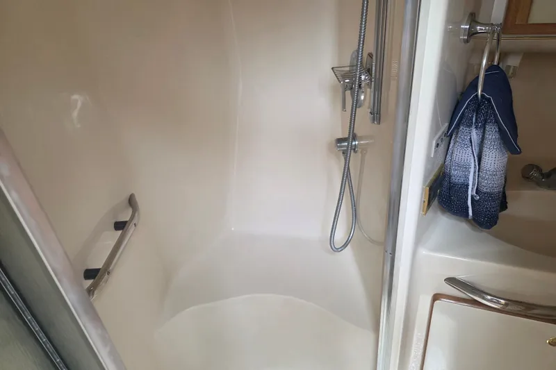 Slide: The Image of Shower area in 1997 Sea Ray 440 Express Bridge yacht with handheld showerhead. - 22