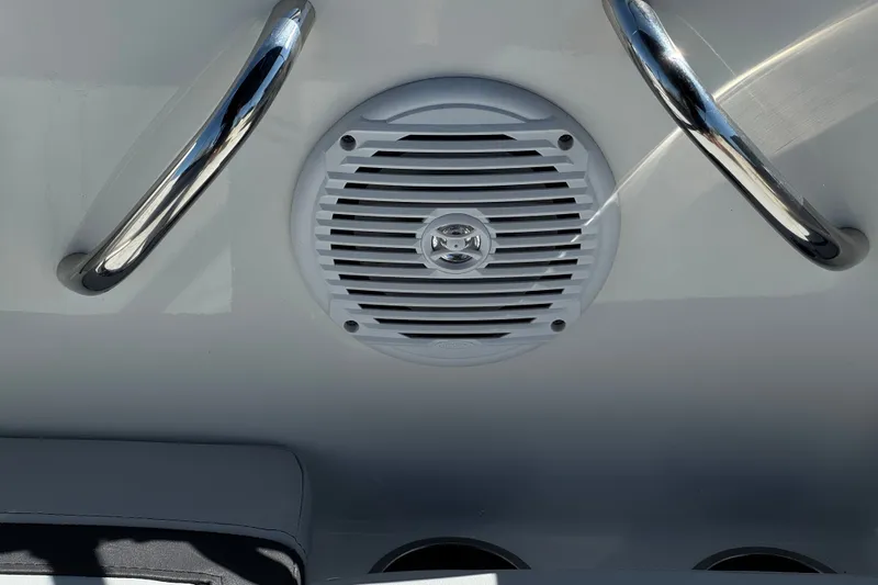 Slide: The Image of 2023 Bayliner Element M17 boat speaker and chrome handles on white surface. - 22