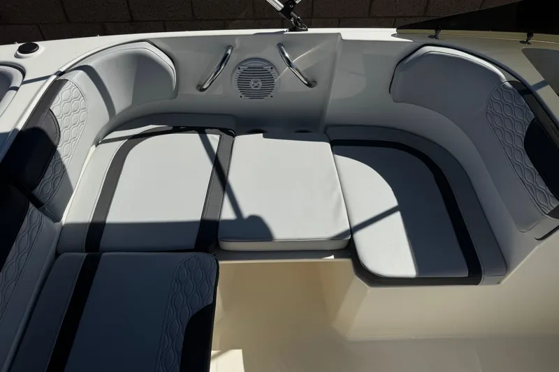 Slide: The Image of 2023 Bayliner Element M17 boat interior with cushioned seating and speaker system. - 21